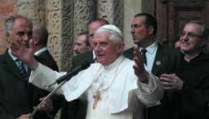 Pope speaks to pilgrims outside the church